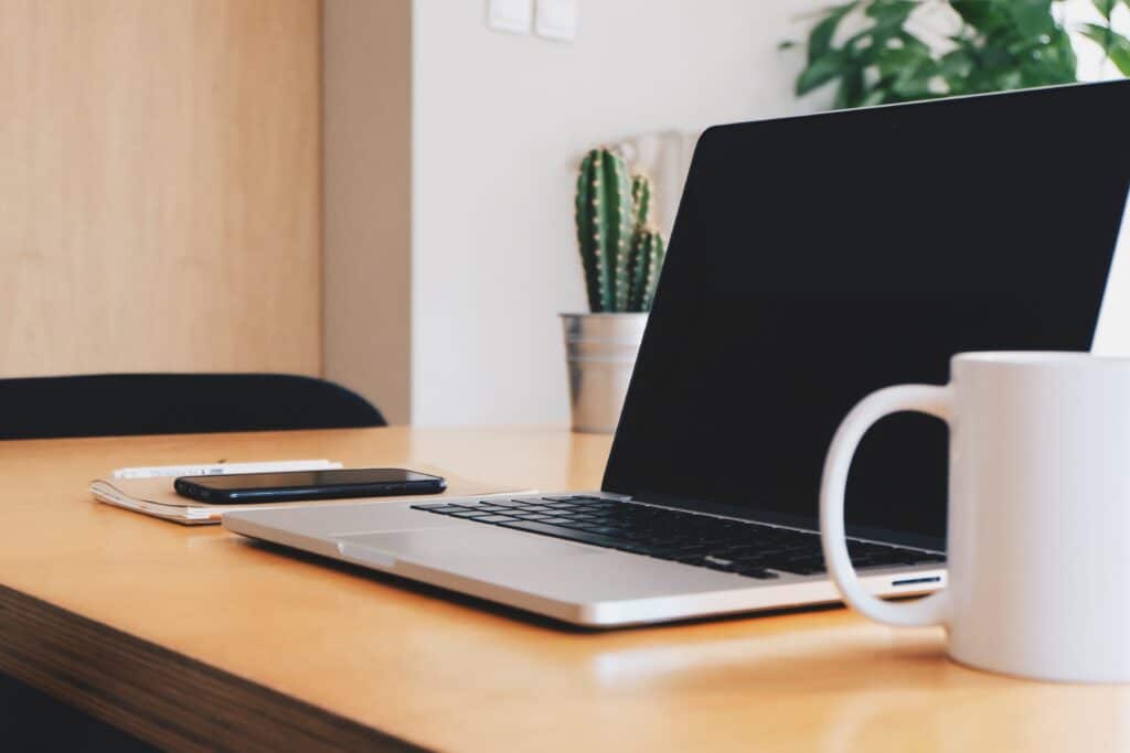 Laptop and coffee mug